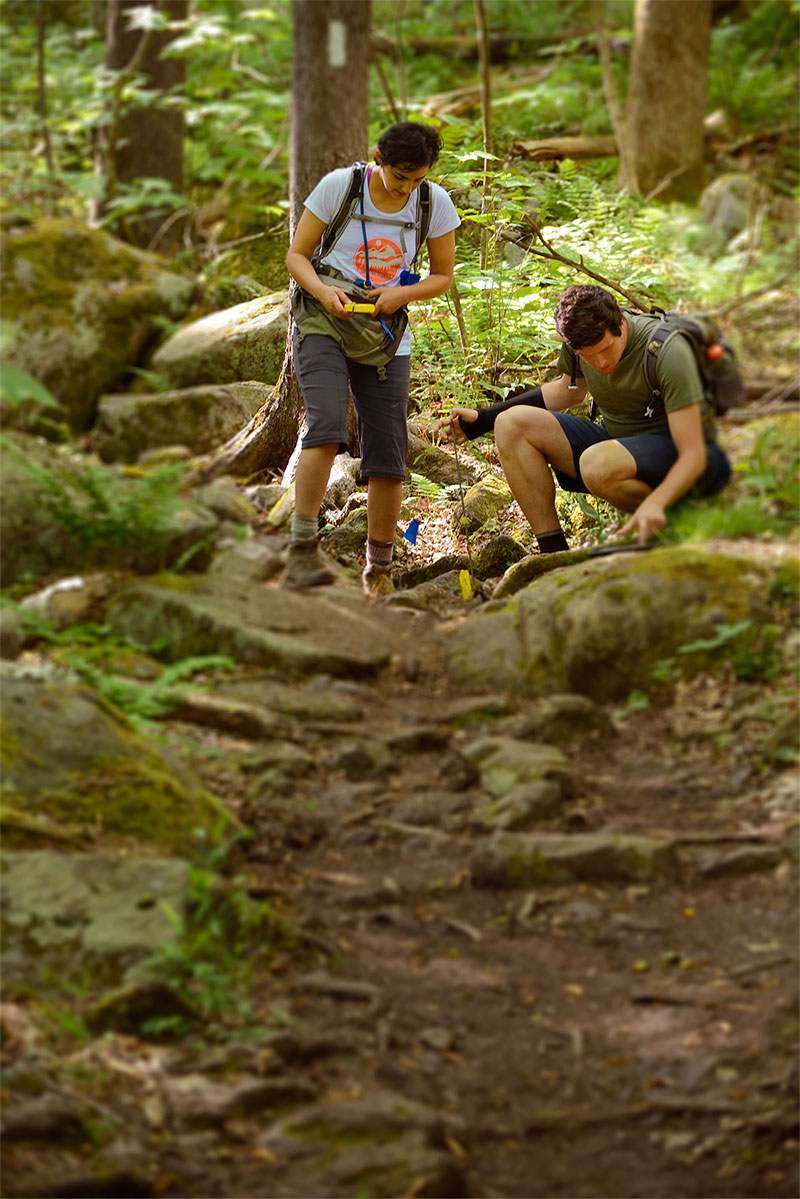 Johanna Arredondo '13 and Fletcher Meadema '12 measure Appalachian Trail conditions