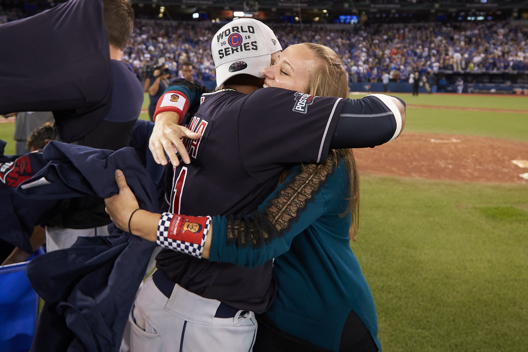 Indians player Carlos Santana and Anna Bolton hug