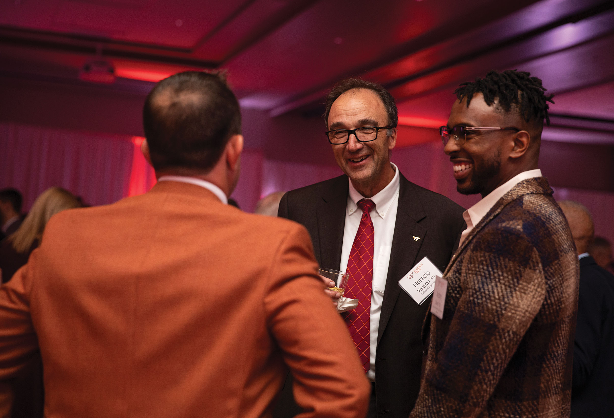 Horacio Valeiras and invited guests enjoy a reception