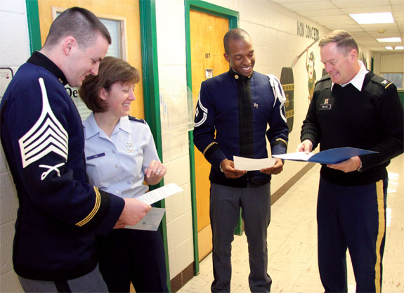 VPI company commander Patrick Nichols (left) and first sergeant Kareim Oliphant (middle) fine-tune their résumés and leadership skills under the tutelage of Col. Dave Miller and Maj. Carrie Cox. Photo by Rock Roszak '71.