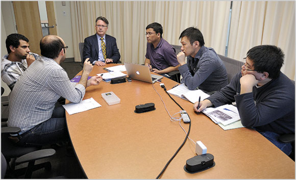 Timothy D. Sands leading a research meeting