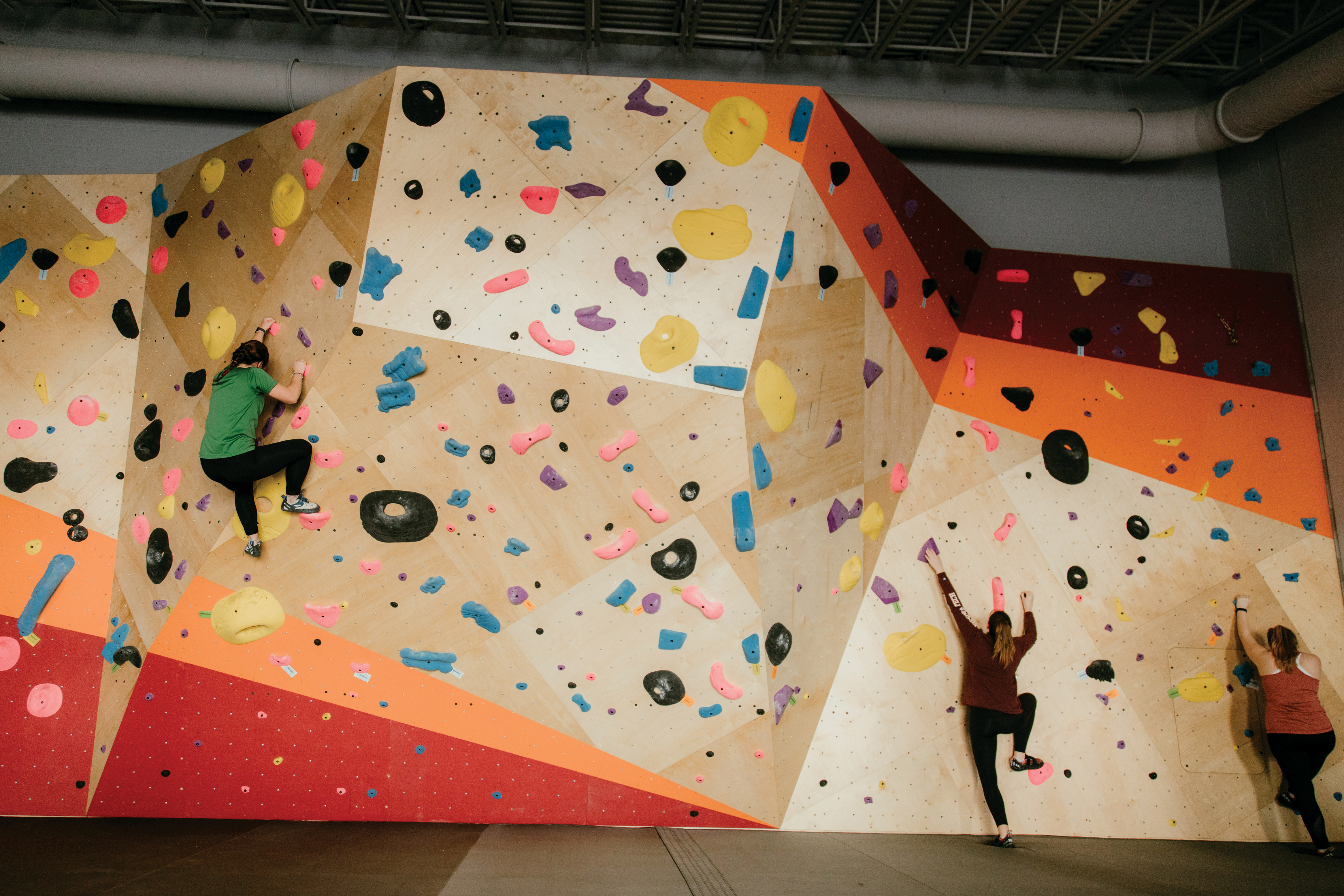 students on climbing wall