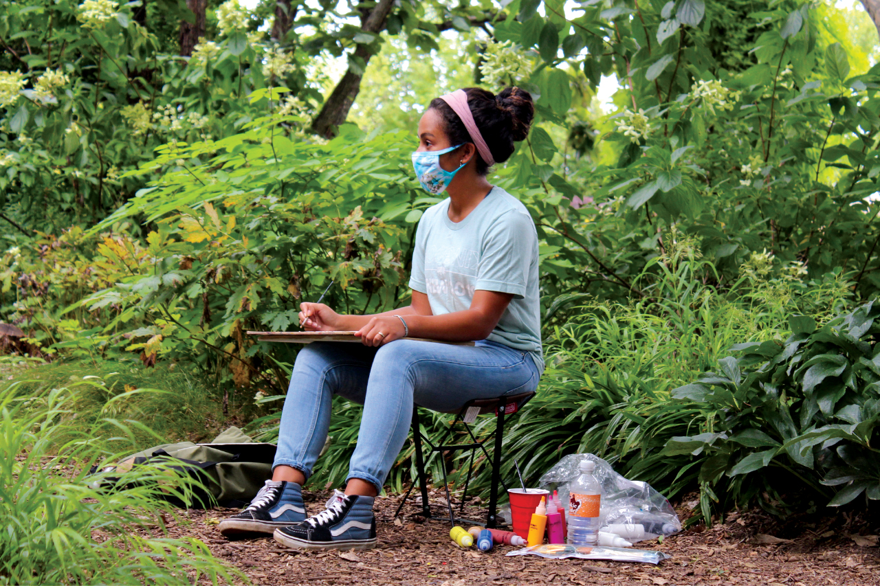 student in woods