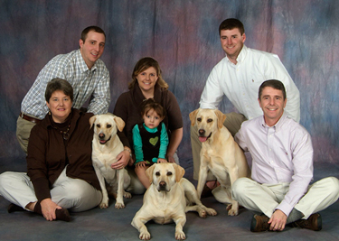 Rob and Kathryn Wittman (bottom row) with their son Josh (upper right), son-in-law Daniel Gooch (upper left), daughter Devon Gooch, and granddaughter Morgan. 