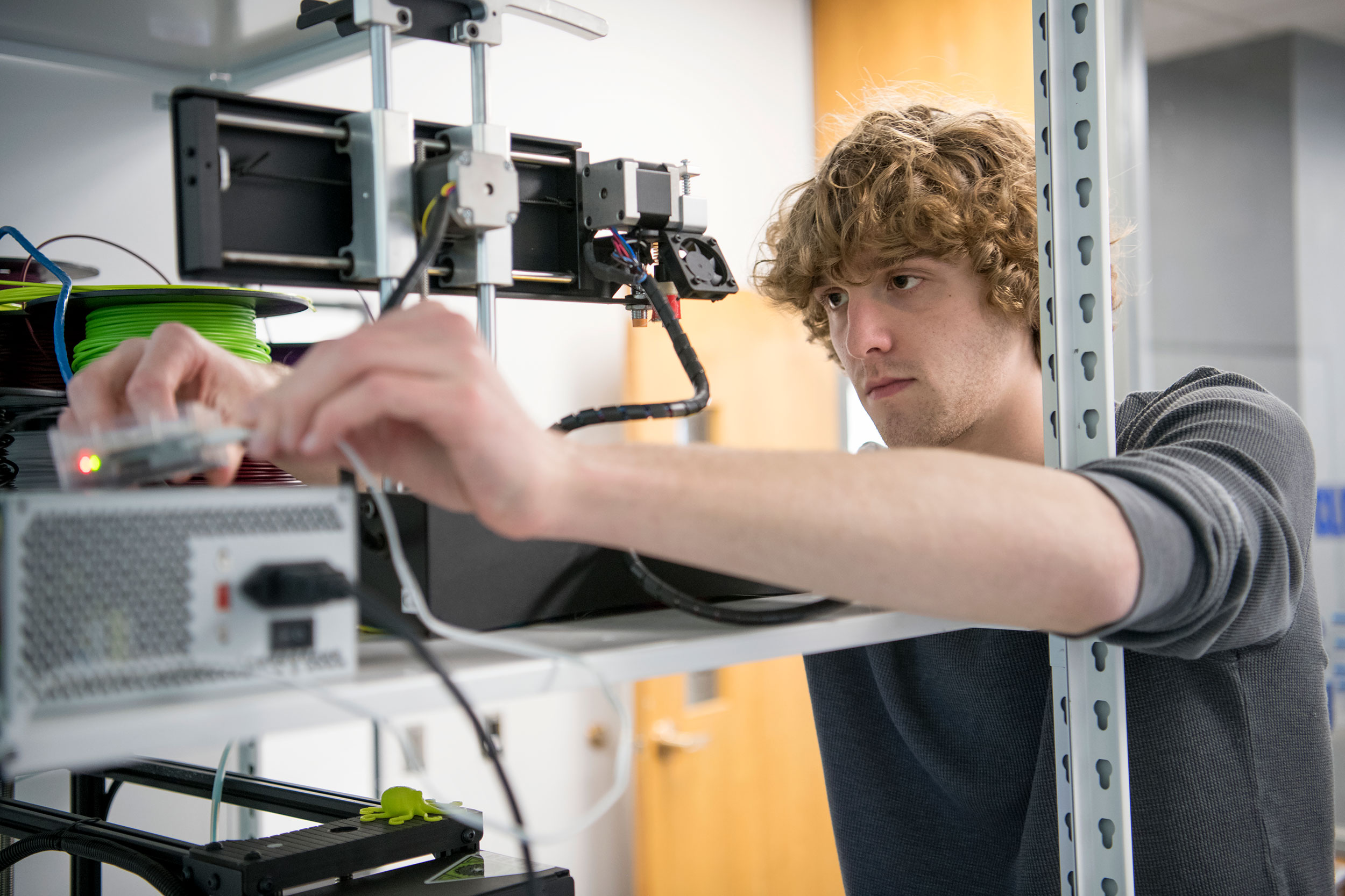 student working with advanced hardware